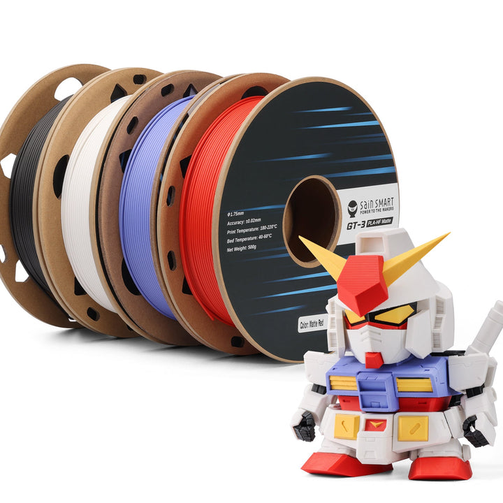 Black, white, red and cobalt blue PLA spools with example robot print