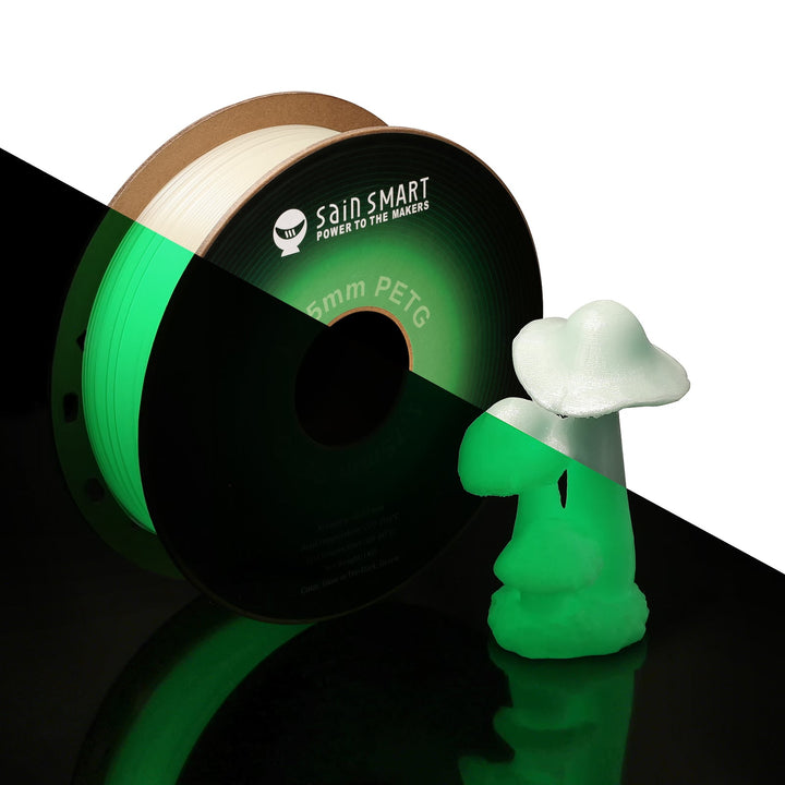 SainSmart glow-green PETG spool and printed figure shown in light and darkness