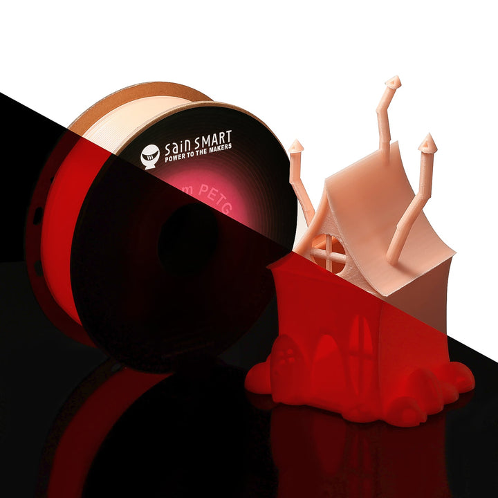 SainSmart glow-red PETG spool with example castle print in light and darkness