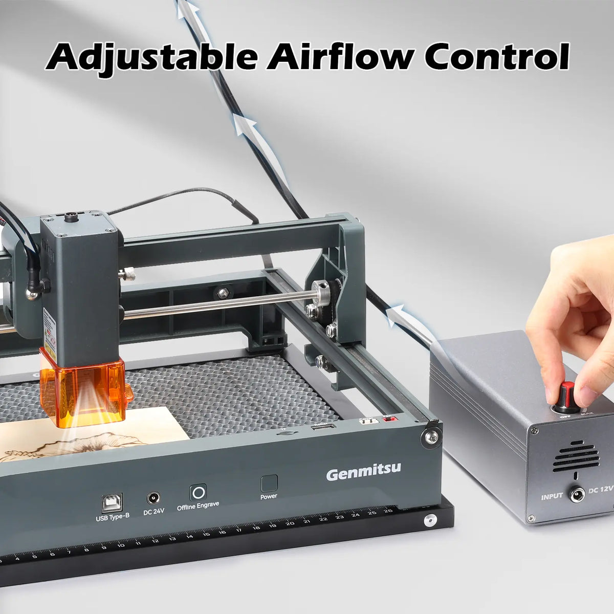 Airflow control knob being adjusted beside a Genmitsu laser engraver