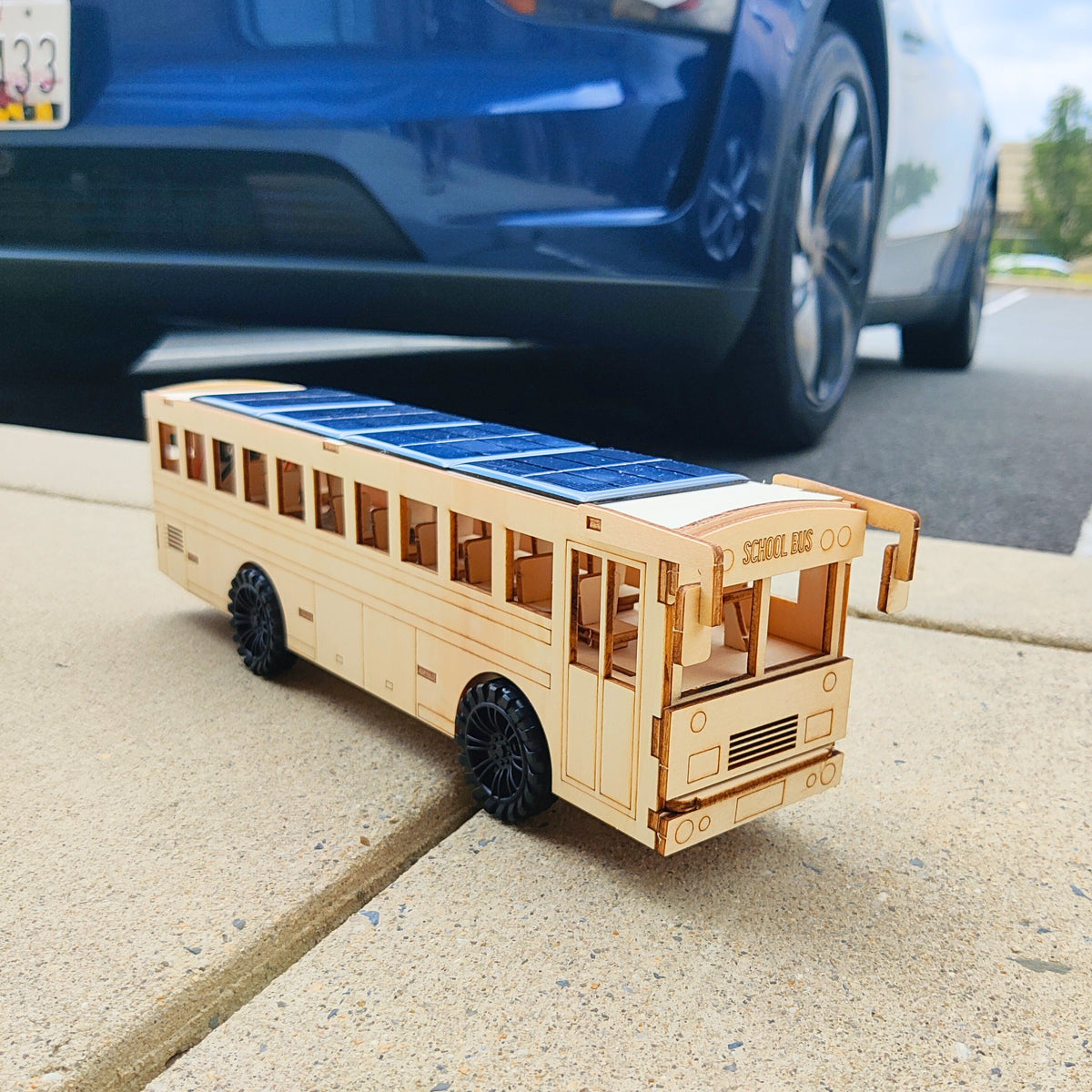 Kitsville Battery & Solar School Bus STEM Kit — unpainted angled view