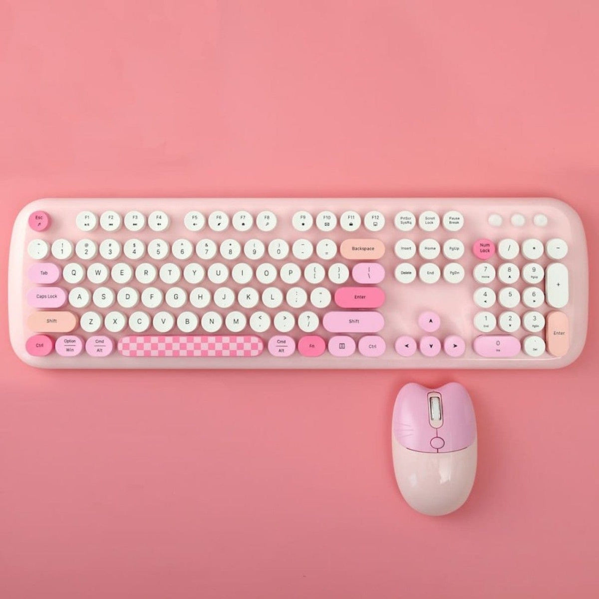 Pink KB10 keyboard and mouse on a pink background
