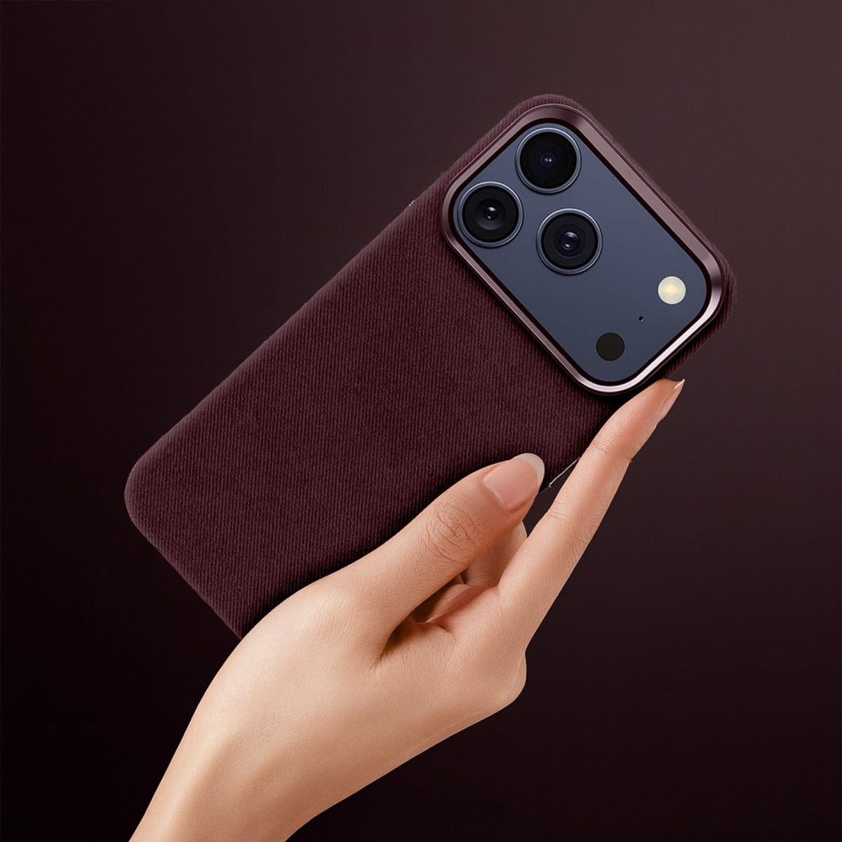 SaharaCase Indy Suede Leather Case for iPhone 17 Pro Max — purple case held in hand