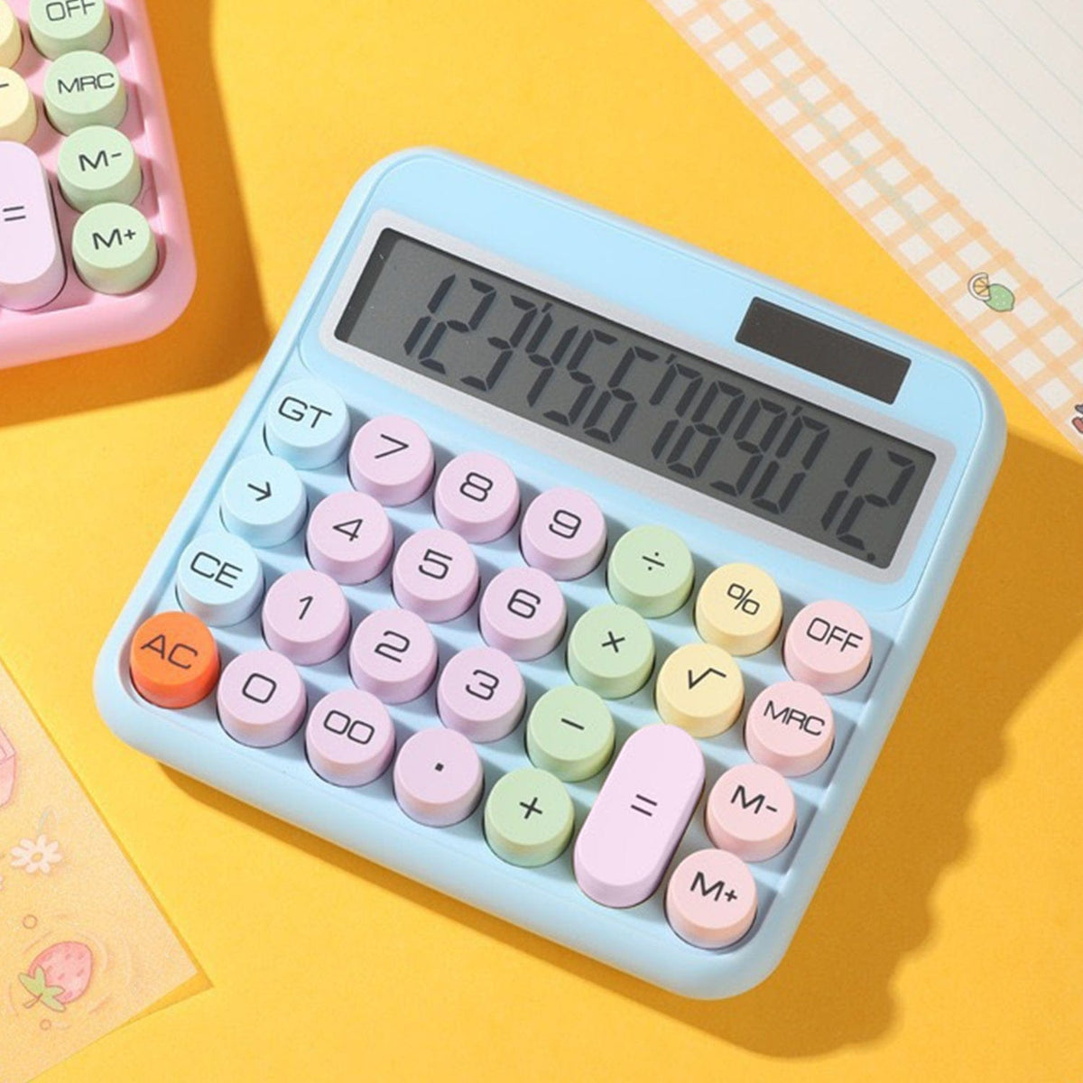 SaharaCase Blue KB50 calculator on a yellow desk background