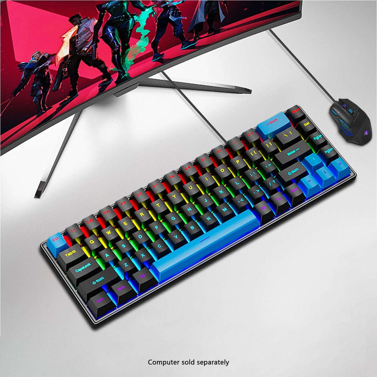 KB32 compact keyboard and mouse below a monitor on a white desk