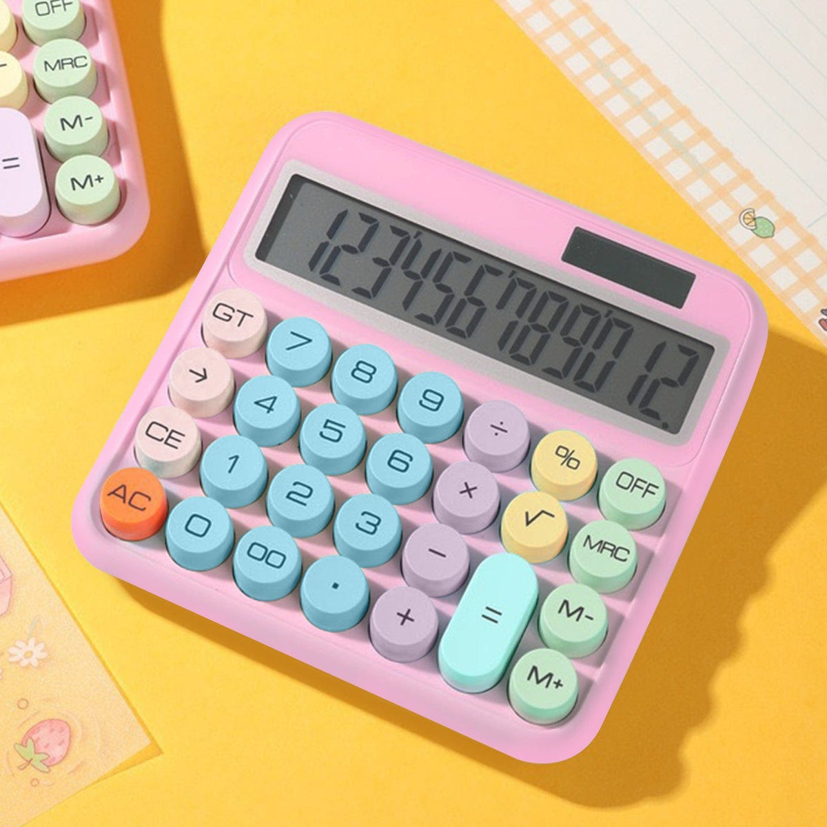 SaharaCase Pink KB52 calculator on a yellow desk background
