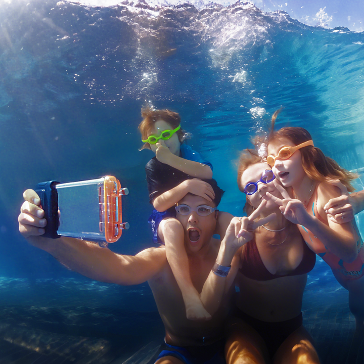 Group taking an underwater selfie with a Sublue H1 phone housing