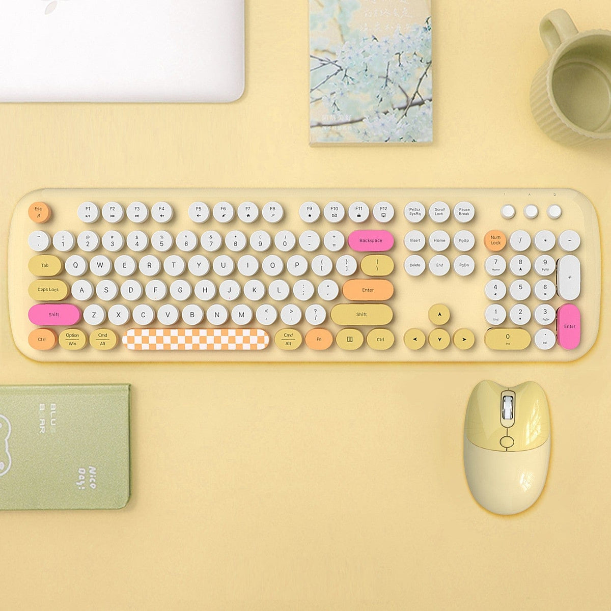 Yellow KB13 keyboard and mouse on a yellow desk