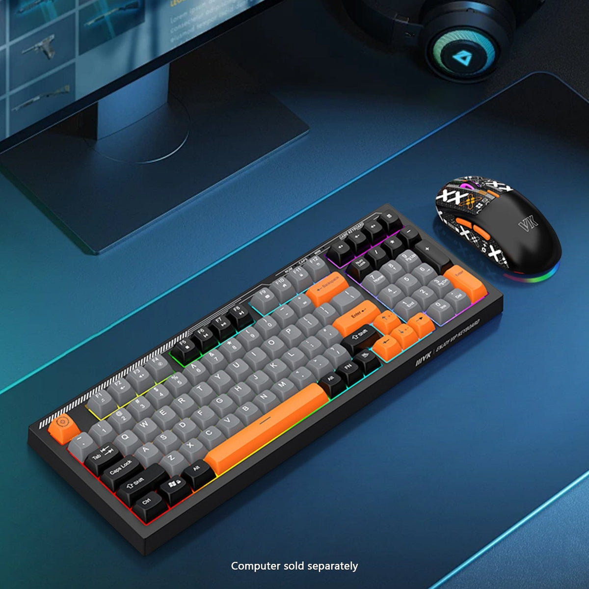 KB29 orange-accent keyboard and mouse on a blue-lit desk