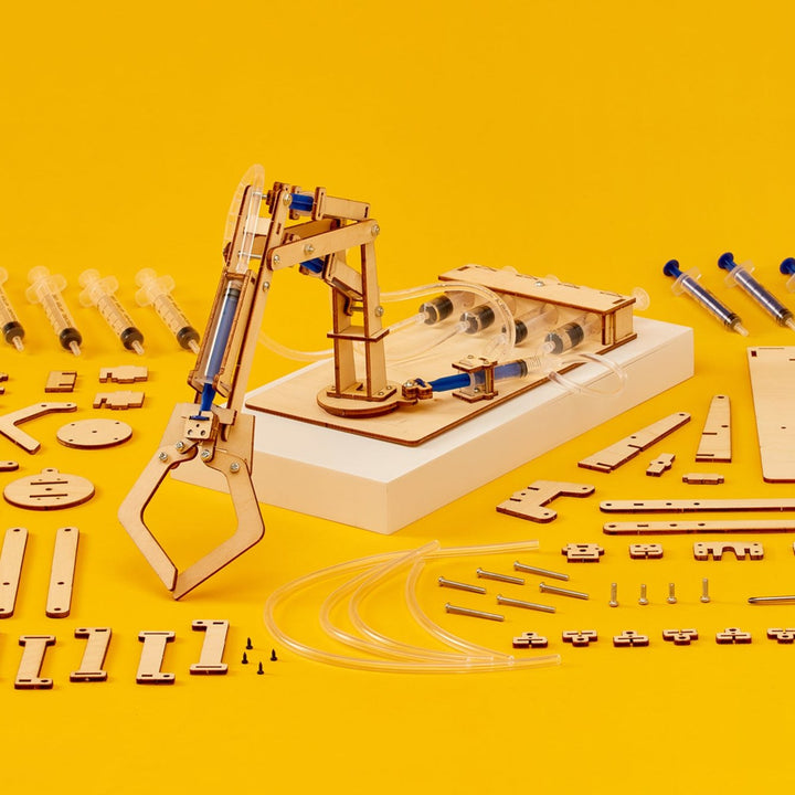 Kitsville ST023: Hydraulic arm and components on yellow background