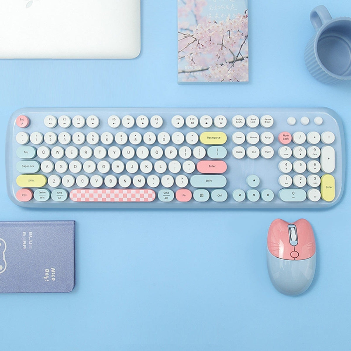 Blue KB11 keyboard and mouse on a blue desk