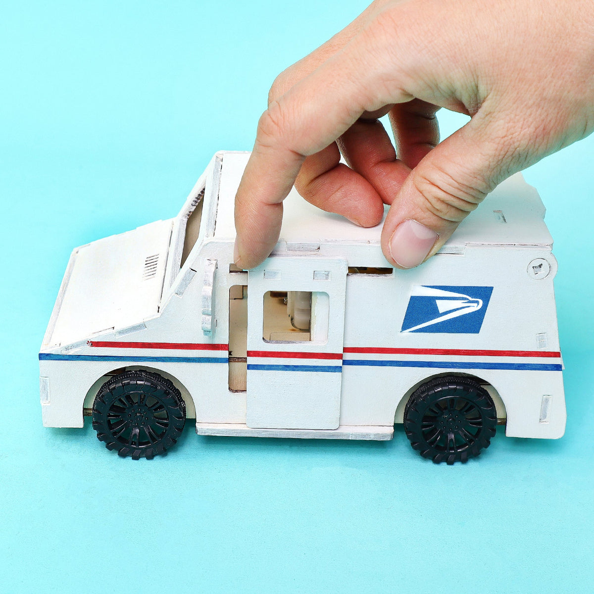 Kitsville Motorized Delivery Truck Building Kit — hand holding front