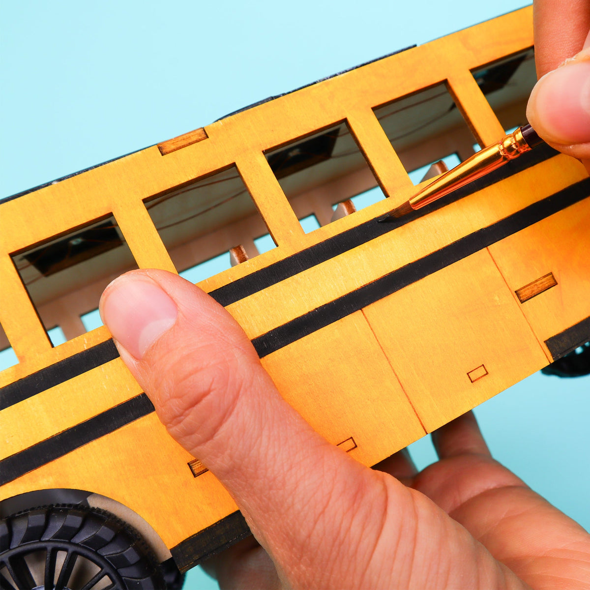 Kitsville Battery & Solar School Bus STEM Kit — hand holding model