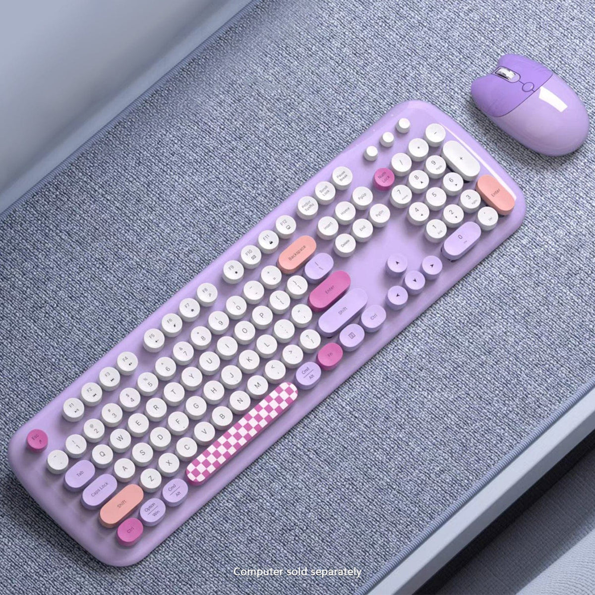 Purple KB12 keyboard and mouse on a textured surface