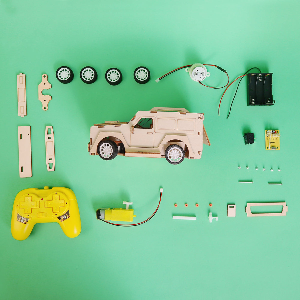 Kitsville 2.4 GHz RC SUV Building Kit — components laid out