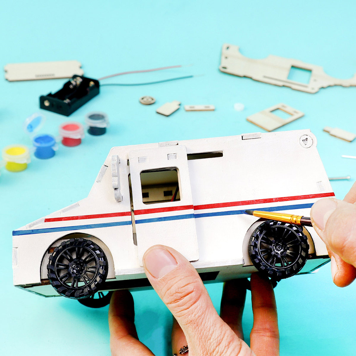Kitsville Motorized Delivery Truck Building Kit — hand holding rear