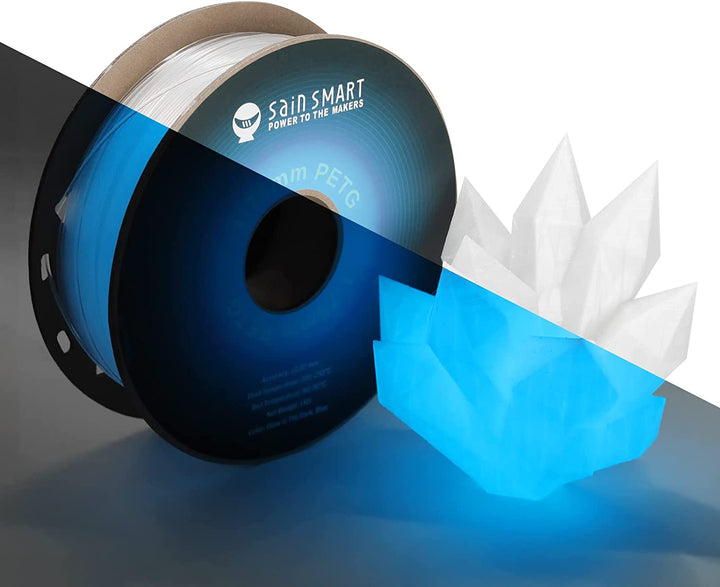 Glow-blue PETG spool with sample print in daylight and darkness