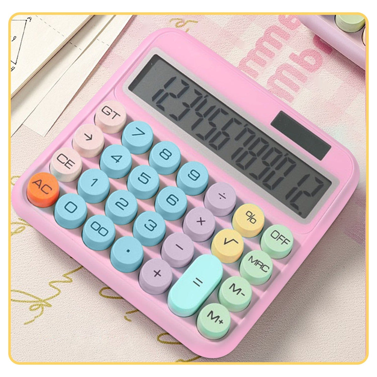 SaharaCase Pink KB52 calculator pictured on a desk with stationery