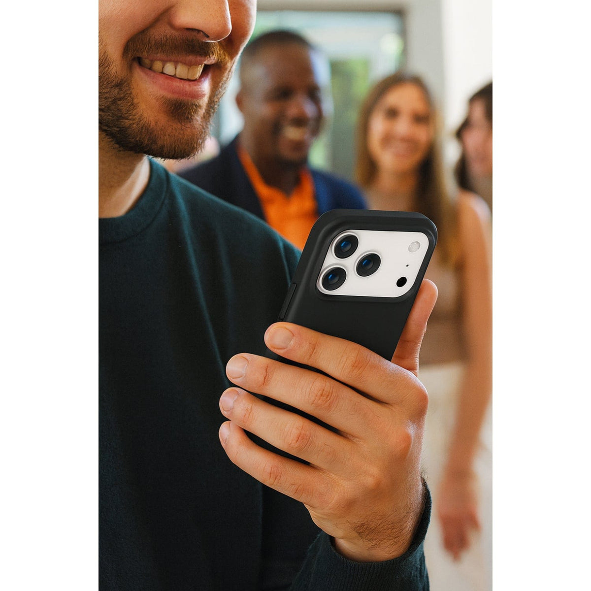 SaharaCase Venture MagSafe-Compatible Silicone Case for iPhone 17 Pro — people holding phone