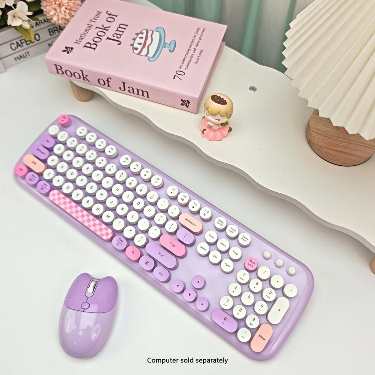 Purple KB12 keyboard and mouse in a desk setting