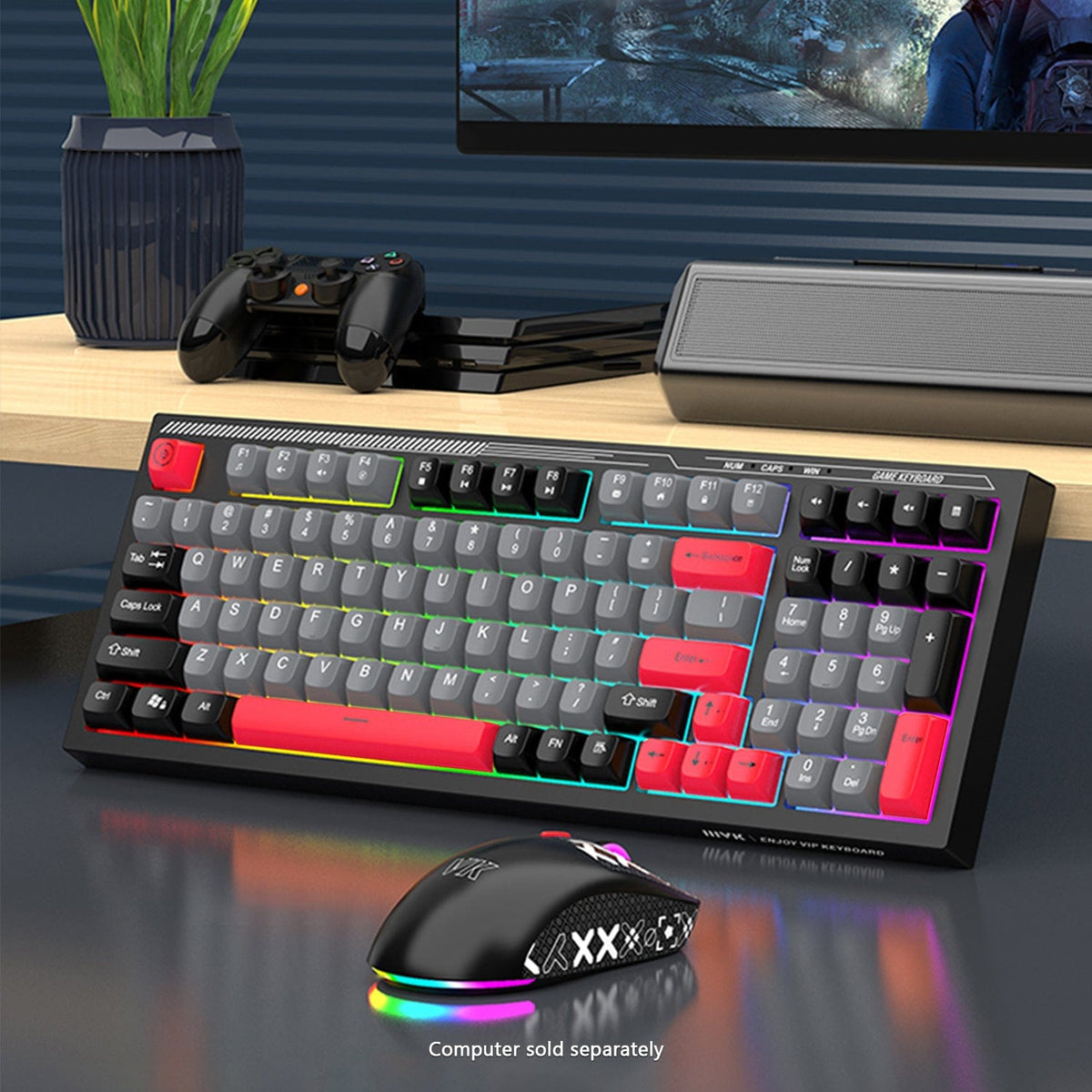 KB30 keyboard and mouse with RGB lighting below a monitor