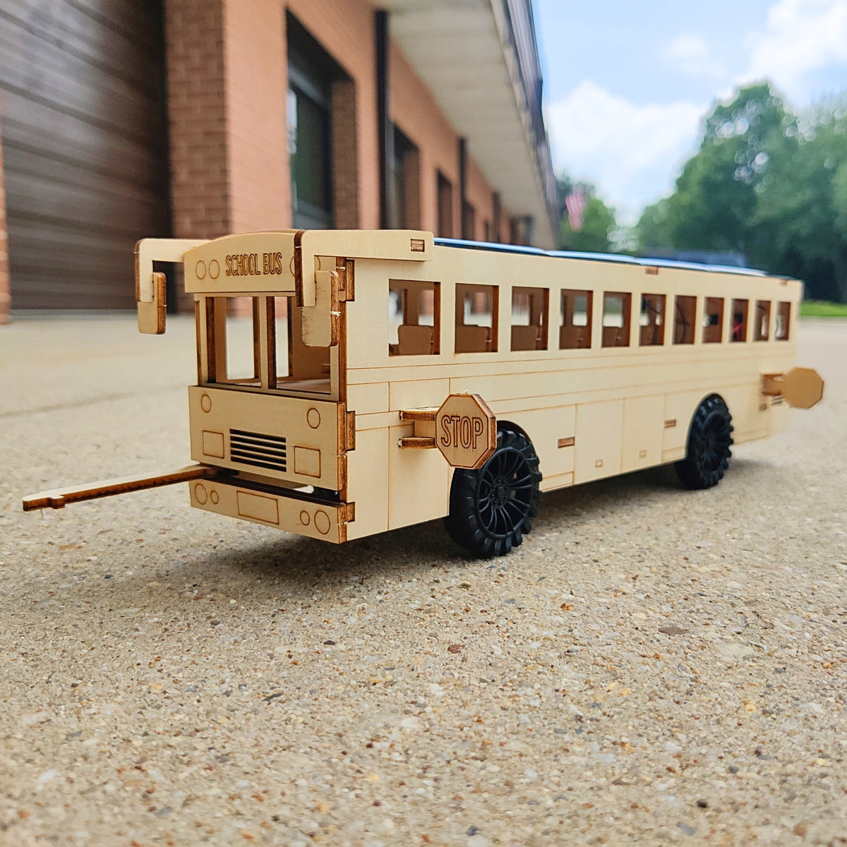 Kitsville Battery & Solar School Bus STEM Kit — unpainted bus outdoors