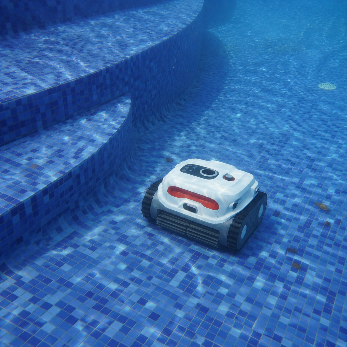 Sublue BN Pro robotic pool cleaner beside underwater steps