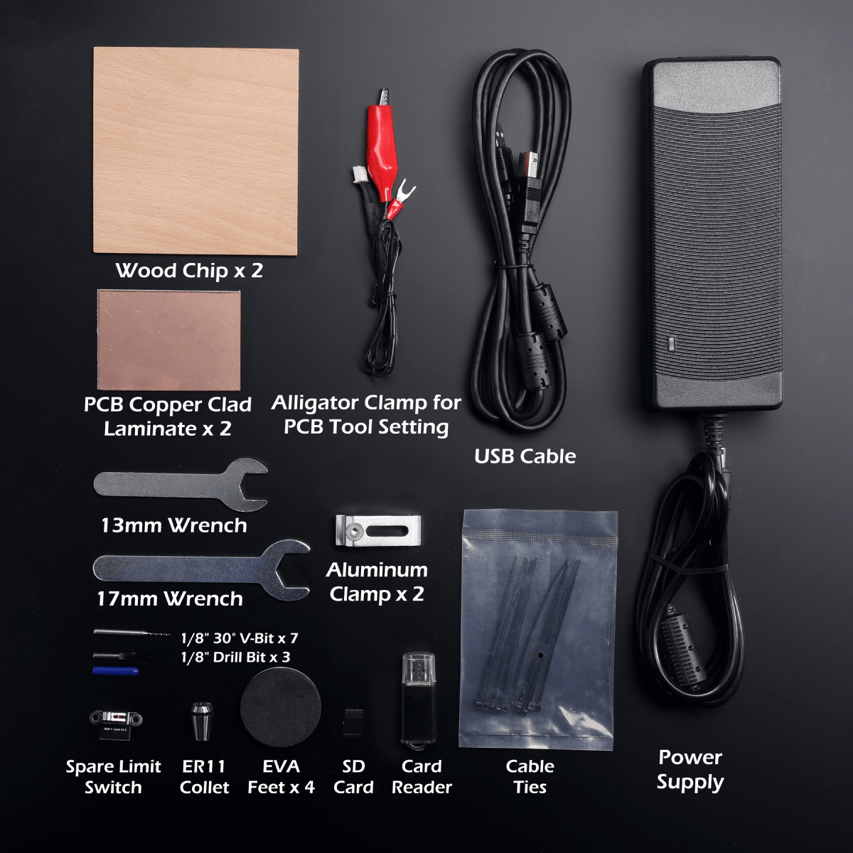 Cubiko accessory layout with sample stock, tool-setting lead, USB cable, power supply and tools