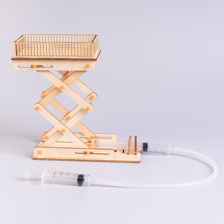 Kitsville Hydraulic Scissor Lift Model Kit — raised hydraulic lift and syringe