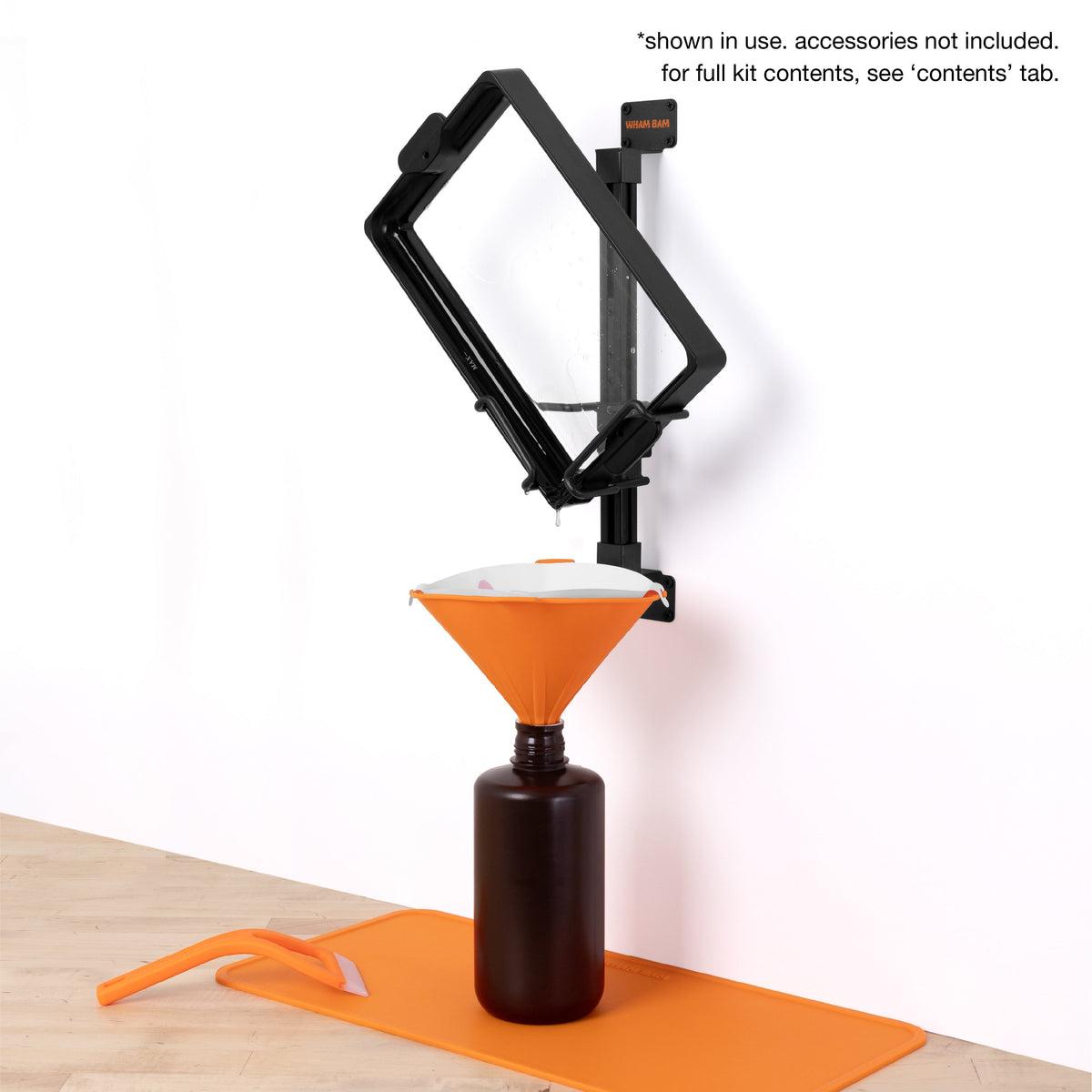 ULTIM8 DRIP holding an example vat above a bottle; accessories not included