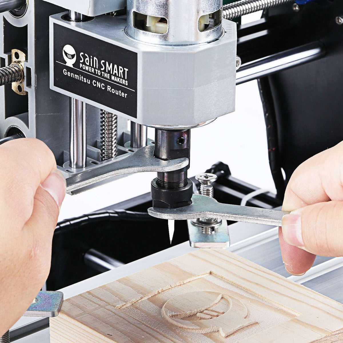 Genmitsu 3018-PRO spindle and collet being adjusted with wrenches