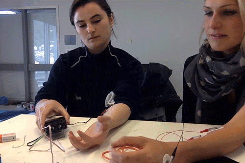 Two participants using the Human-Human Interface at a table