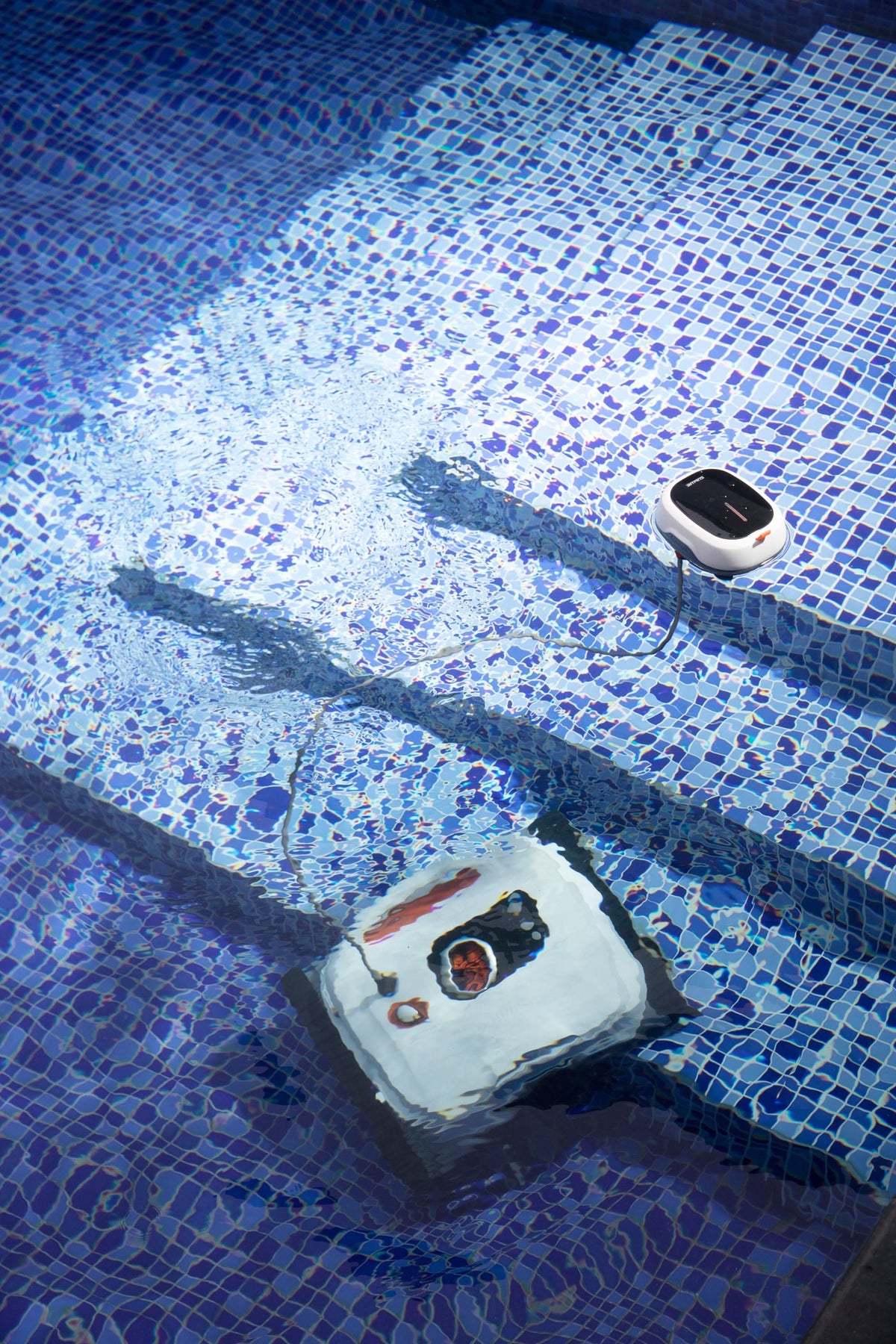 Sublue BN Pro robotic pool cleaner cleaning tiled pool steps