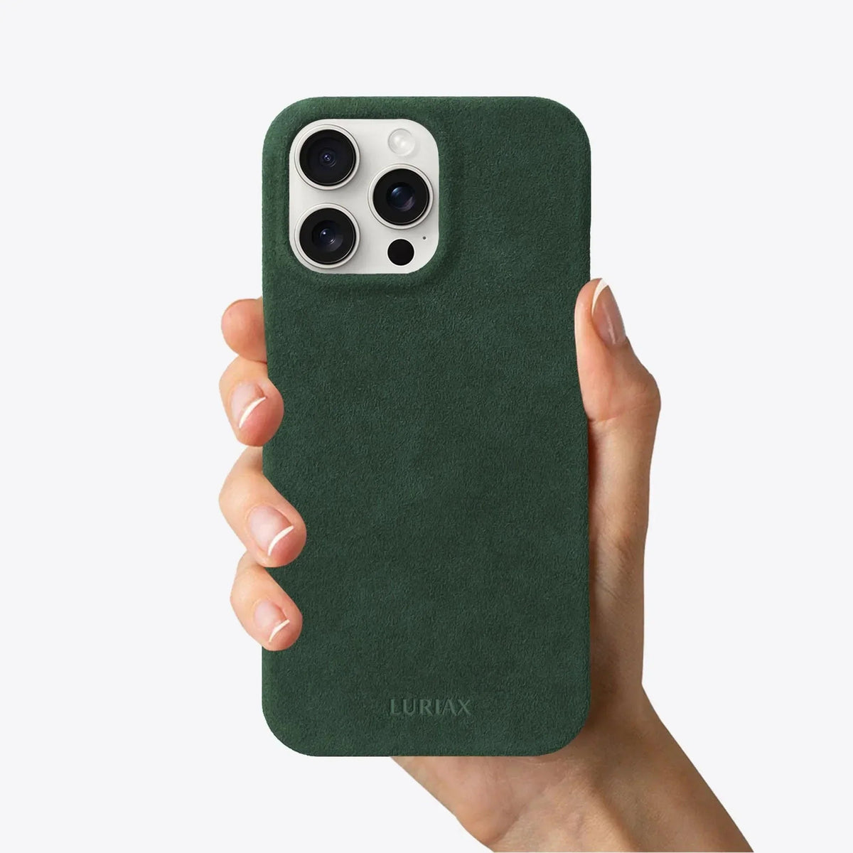 Luriax Minimal iPhone 15 Case — British Racing Green — shown held in a hand
