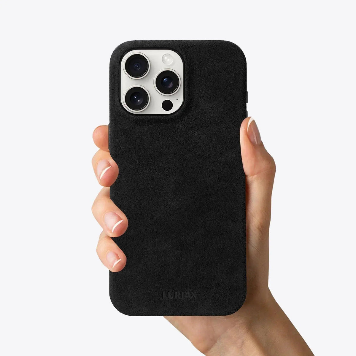 Luriax Signature Handcrafted Case iPhone 15 — Pure Black — shown held in a hand