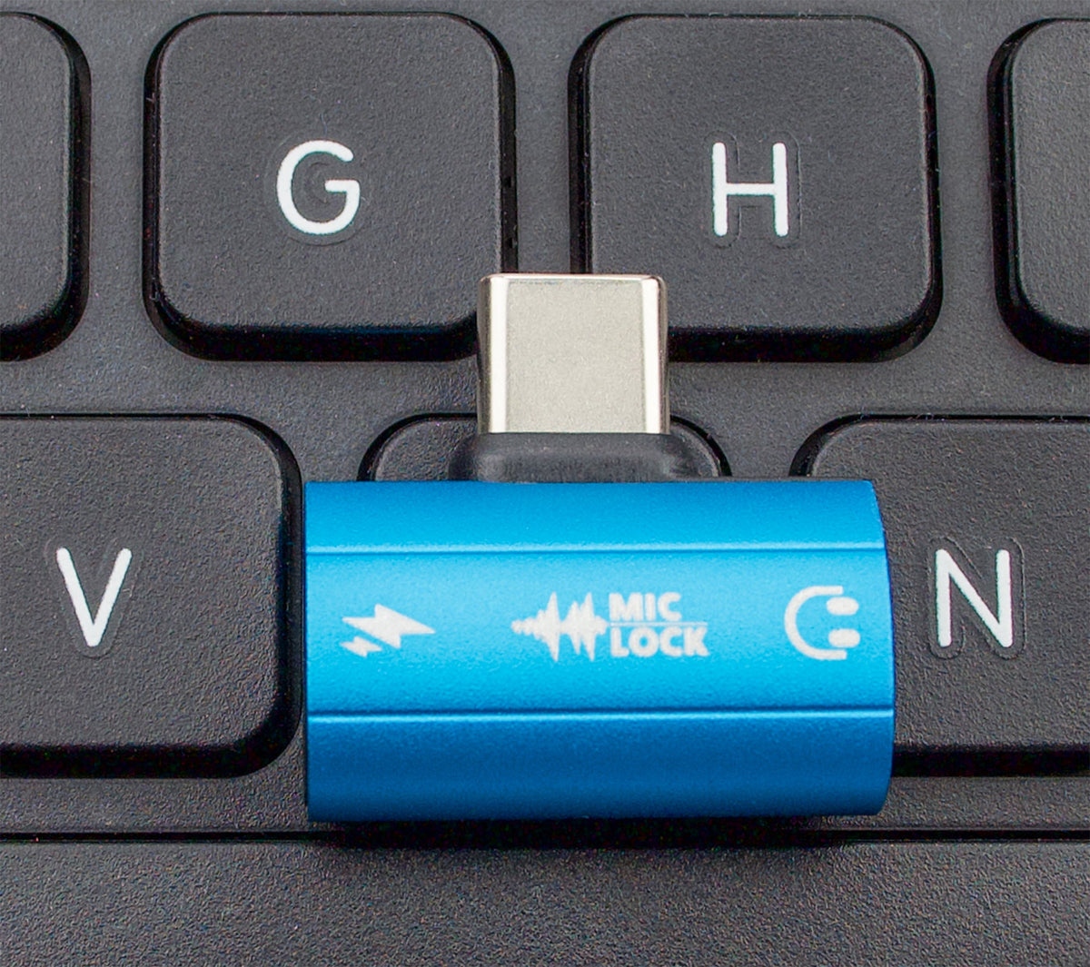 Mic-Lock Blue HiFi adapter on keyboard for scale