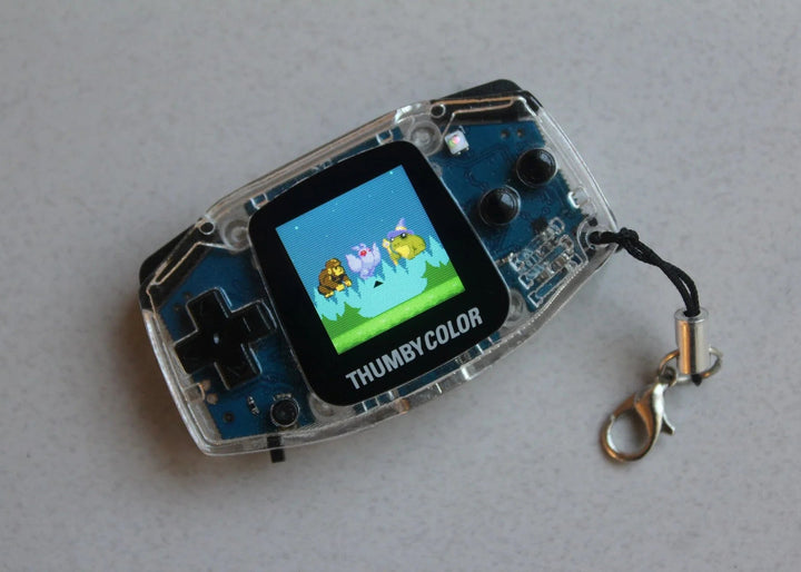 Clear Thumby Color console with game on its color screen