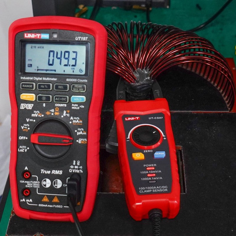 UNI-T UT-CS07 shown in use with a separate multimeter, not included