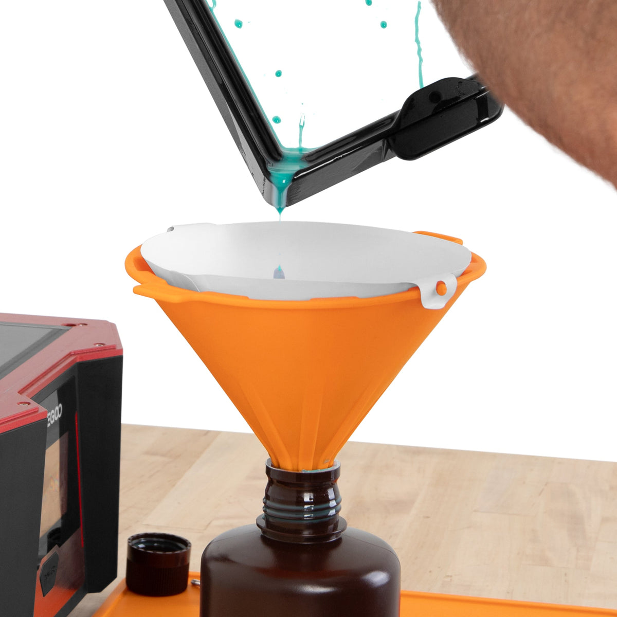 Pouring resin through ULTIM8 FUN with a paper filter; filter and bottle not included