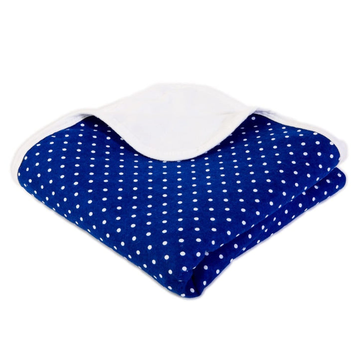 Folded navy SYB Baby Blanket with white dots