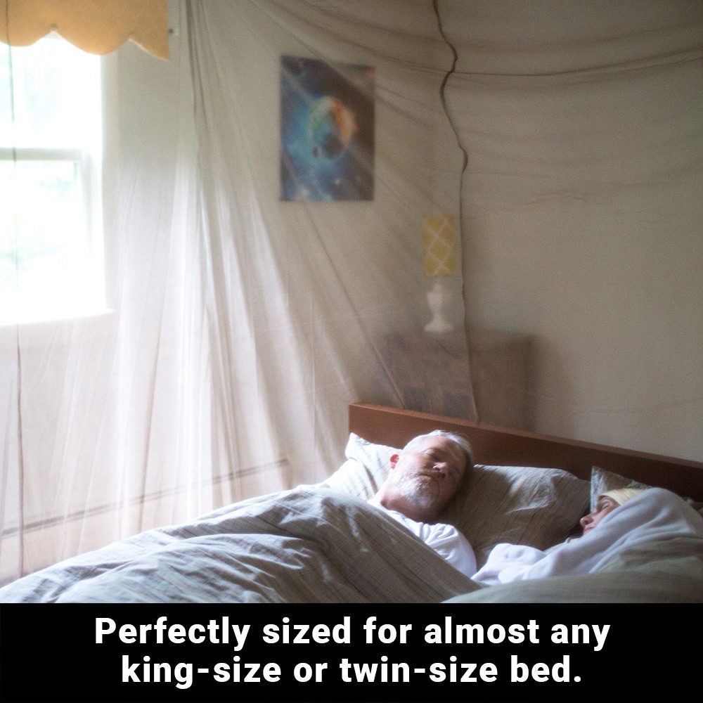 Person resting inside SYB bed canopy