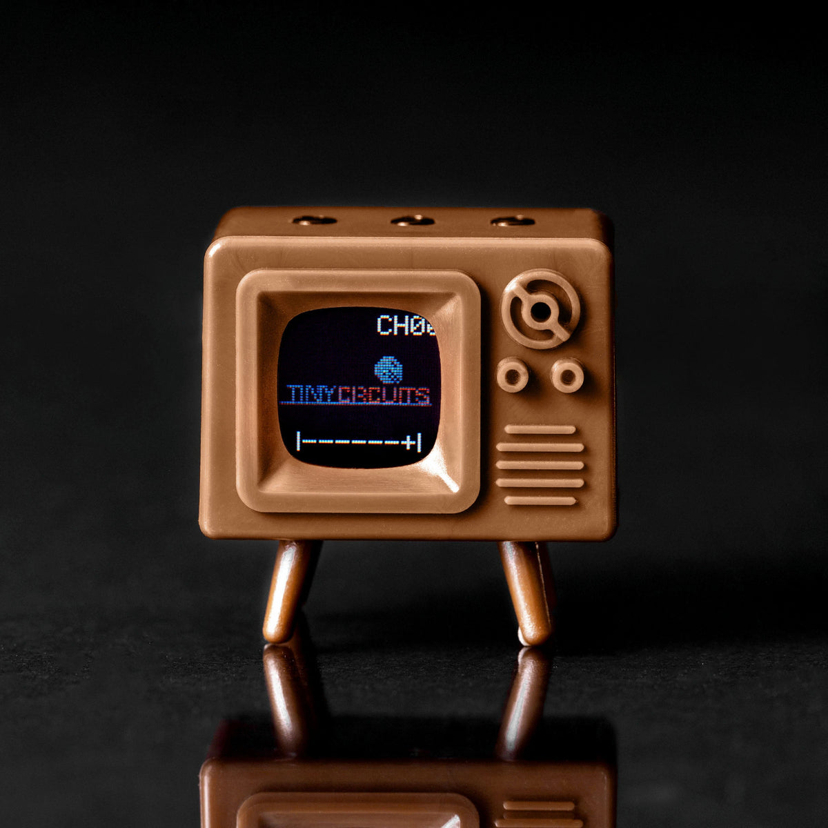 Brown TinyTV Mini front view and top buttons