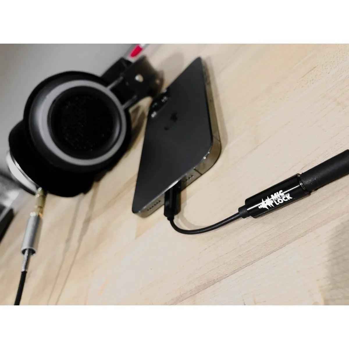 Mic-Lock Lightning SoundPass with phone and over-ear headphones