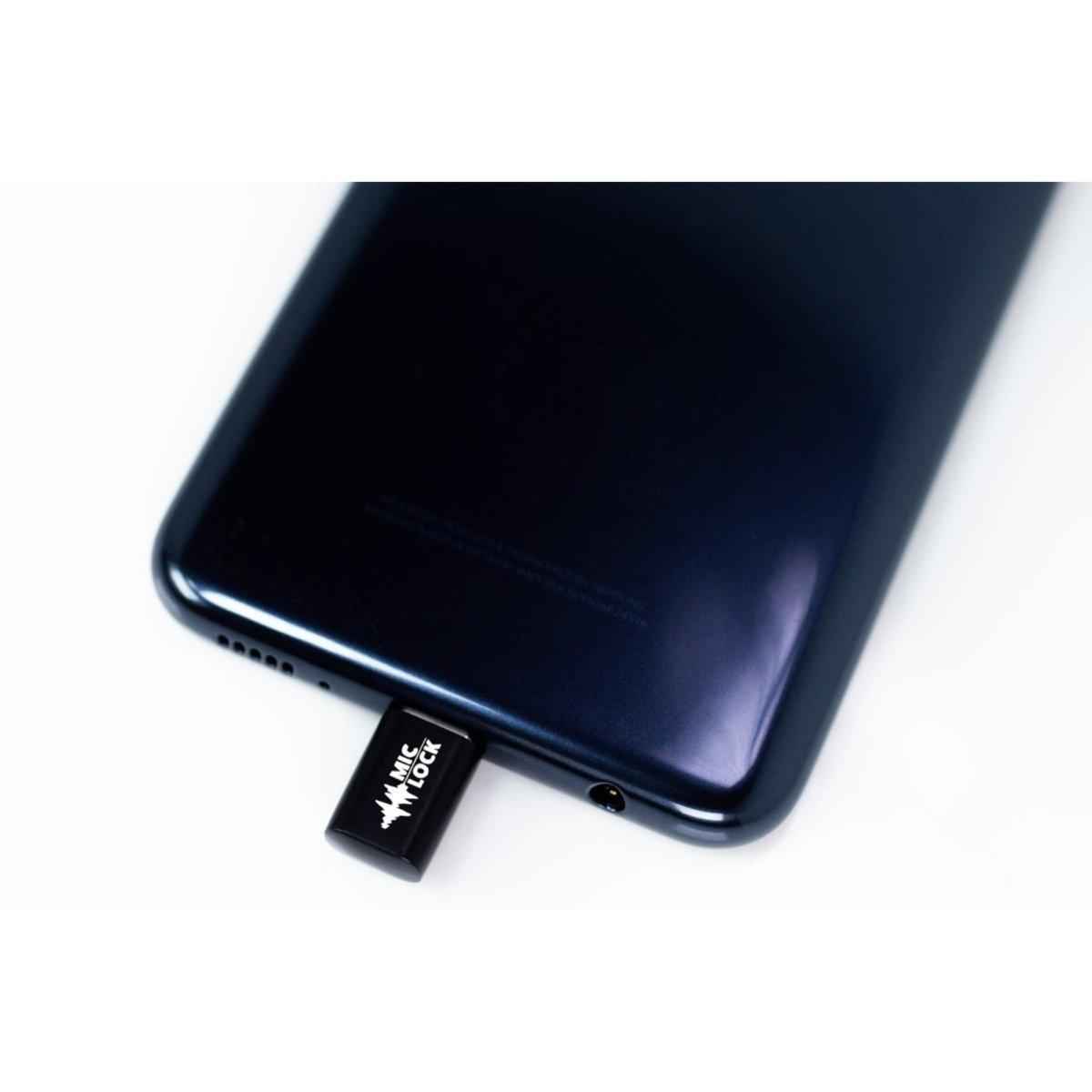 Mic-Lock Black USB-C Mini blocker connected to a phone