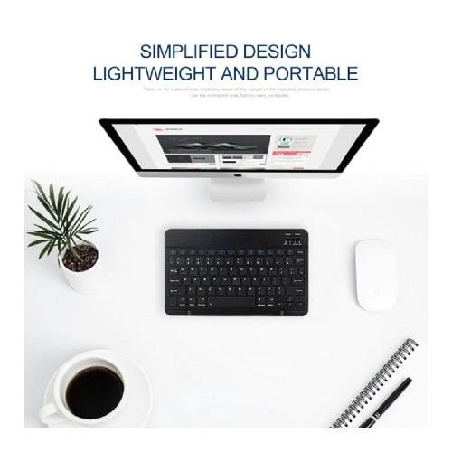 Compact black SaharaCase keyboard in a desk setting with computer sold separately