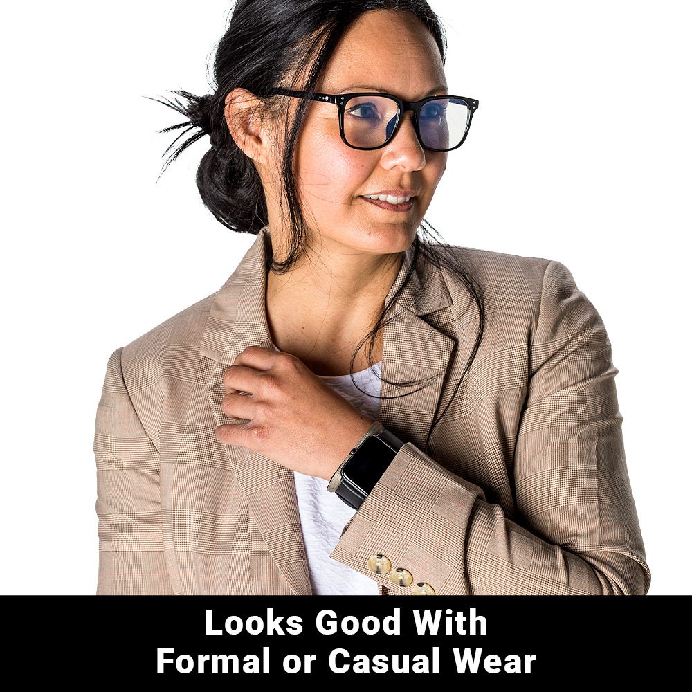 Person wearing SYB Wrist Band beneath a watch with jacket